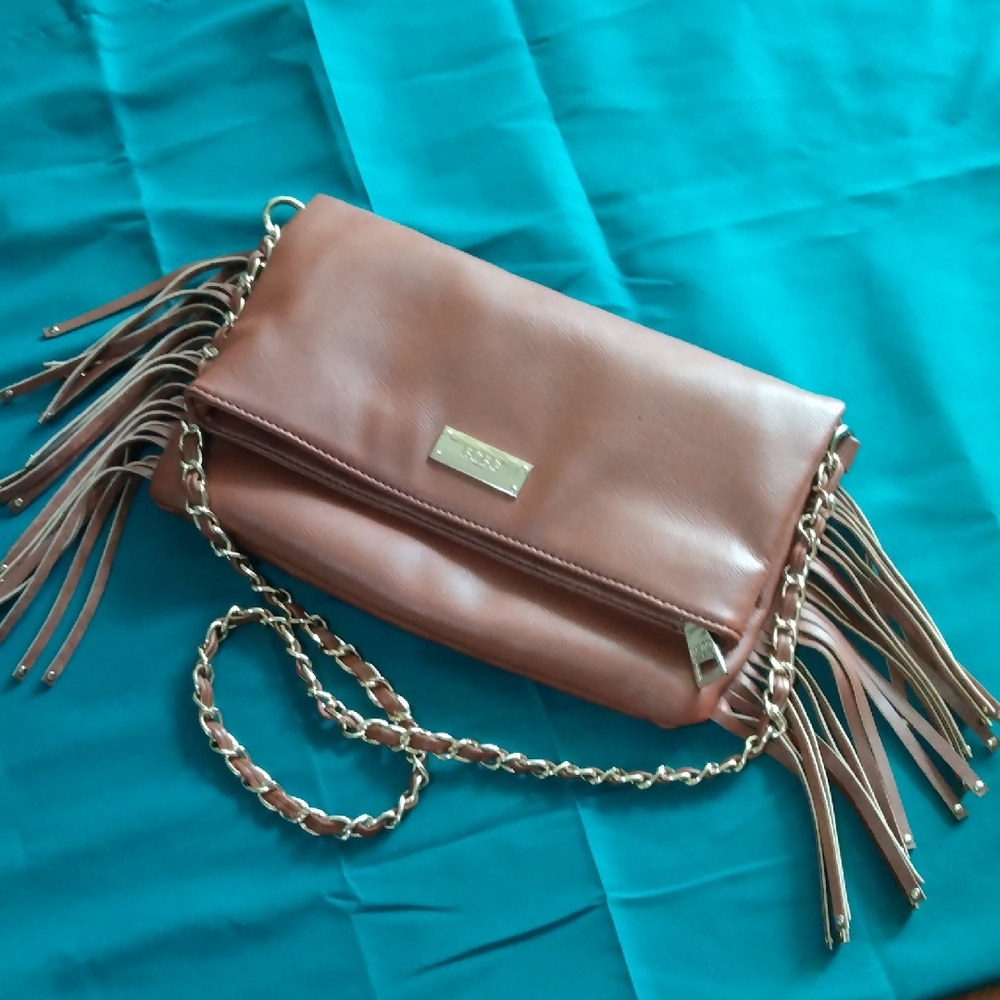 BCBG Paris Tan Wristlet with Chain Strap and Tassels